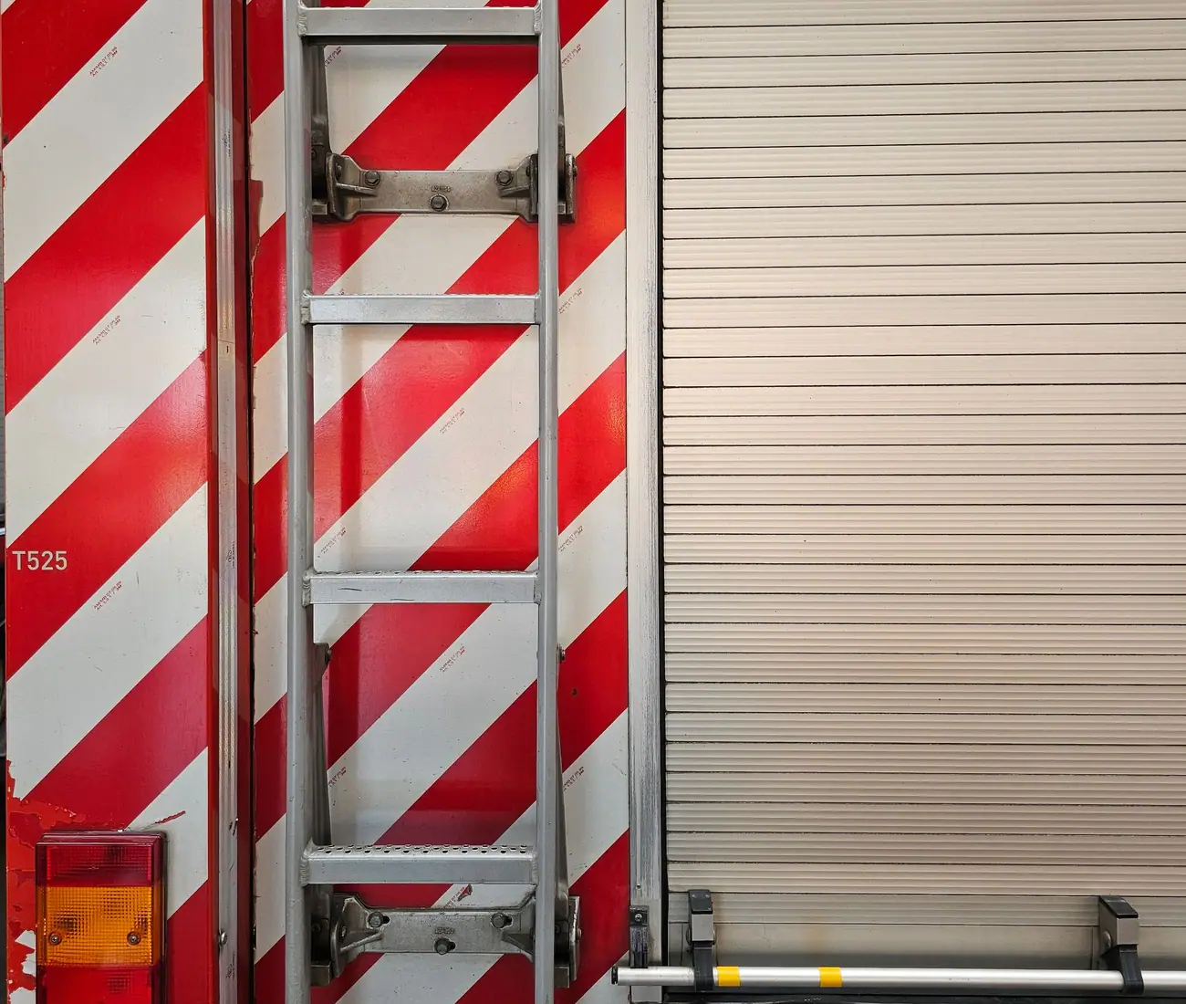 A rear chevron kit in red and white retroreflective sheeting, the manufacturer legend repeated along every stripe